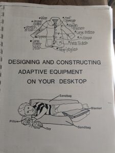 Book cover: Designing and Constructing Adaptive Equipment on your desktop. diagram of child lying on adaptive pillows, design of overcoat with adaptive fastenings