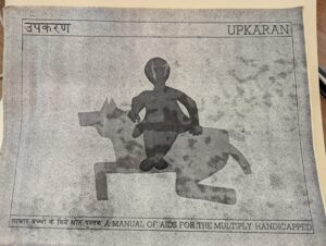 book cover in english and hindi: Upkaran, a manual of aids for the multiply handicapped